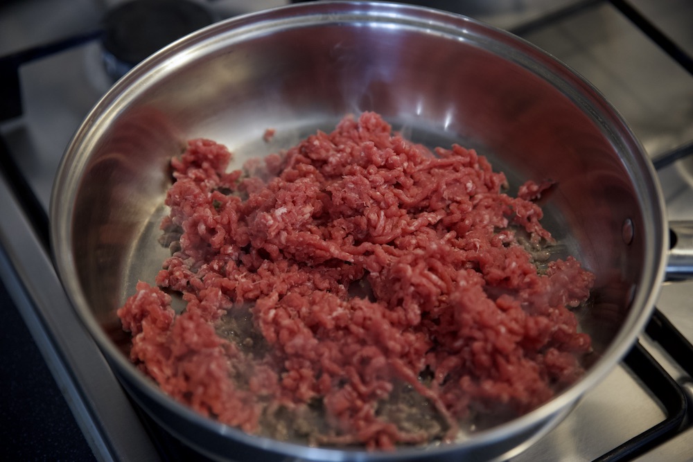 raw mince meat in a pan