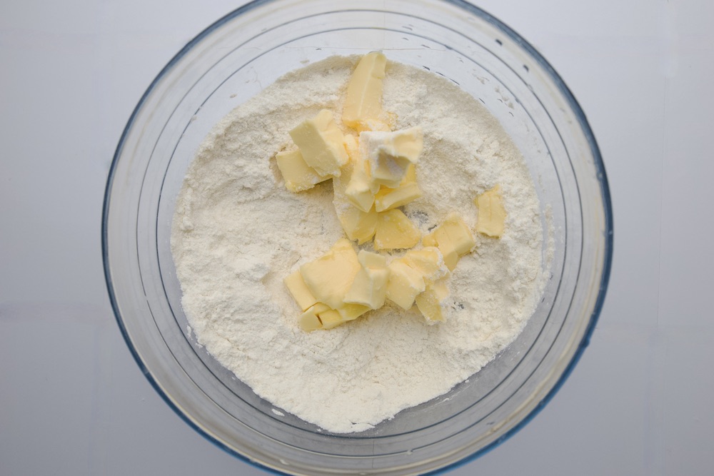 flour and cubed butter in a bowl
