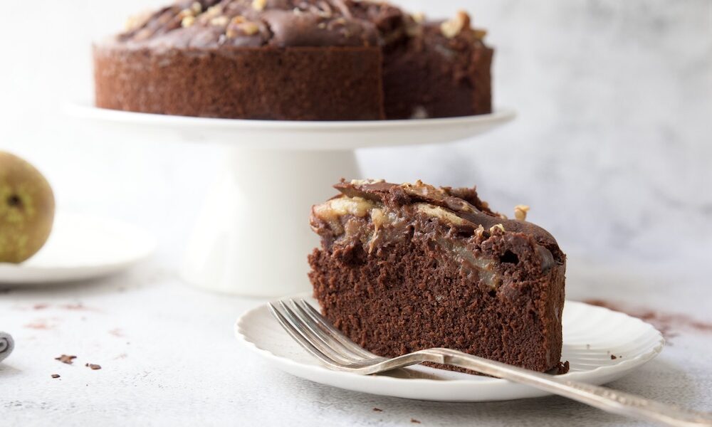Slice of Soft chocolate cake with pears and walnuts