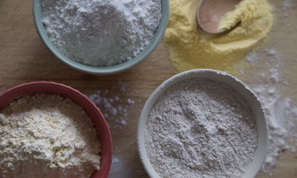 few small bowls with types of gluten-free flour