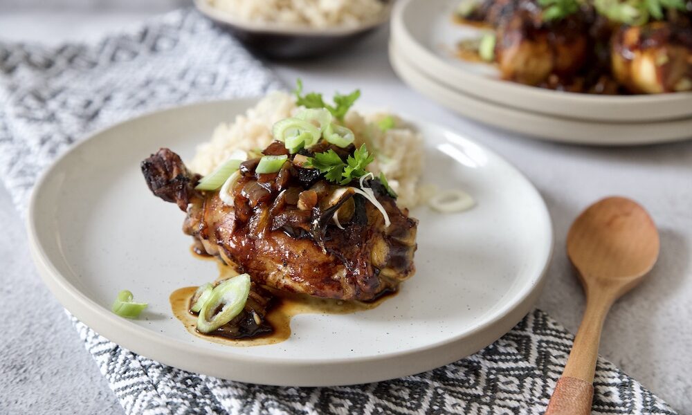 adobo chicken served with rice and fresh spring onion