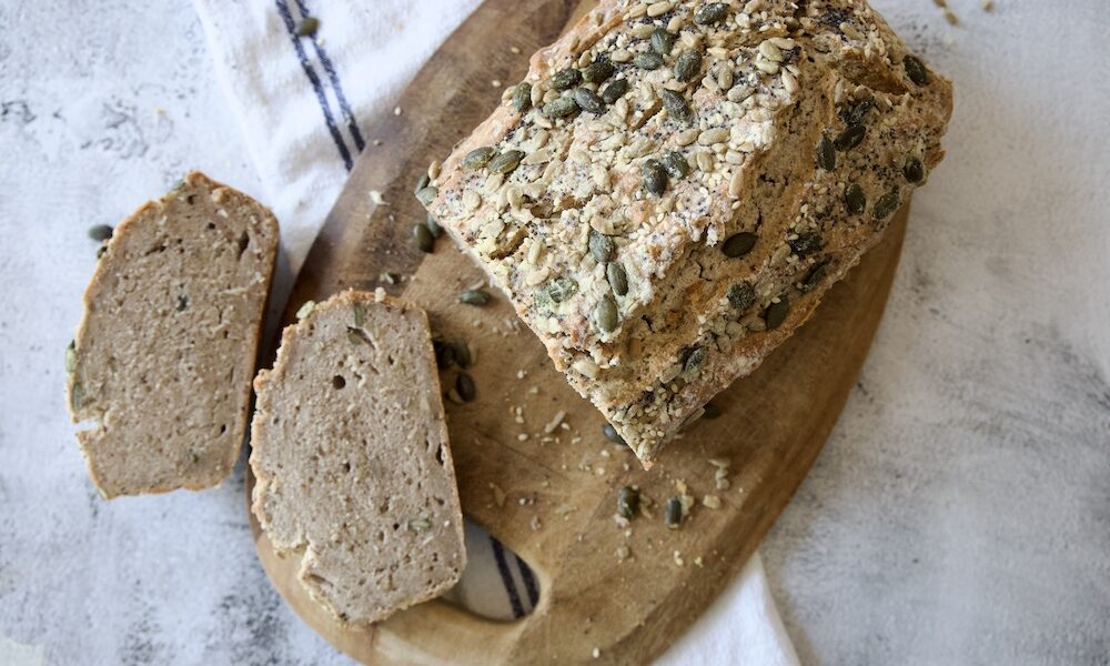 seeded bread loaf with two slies